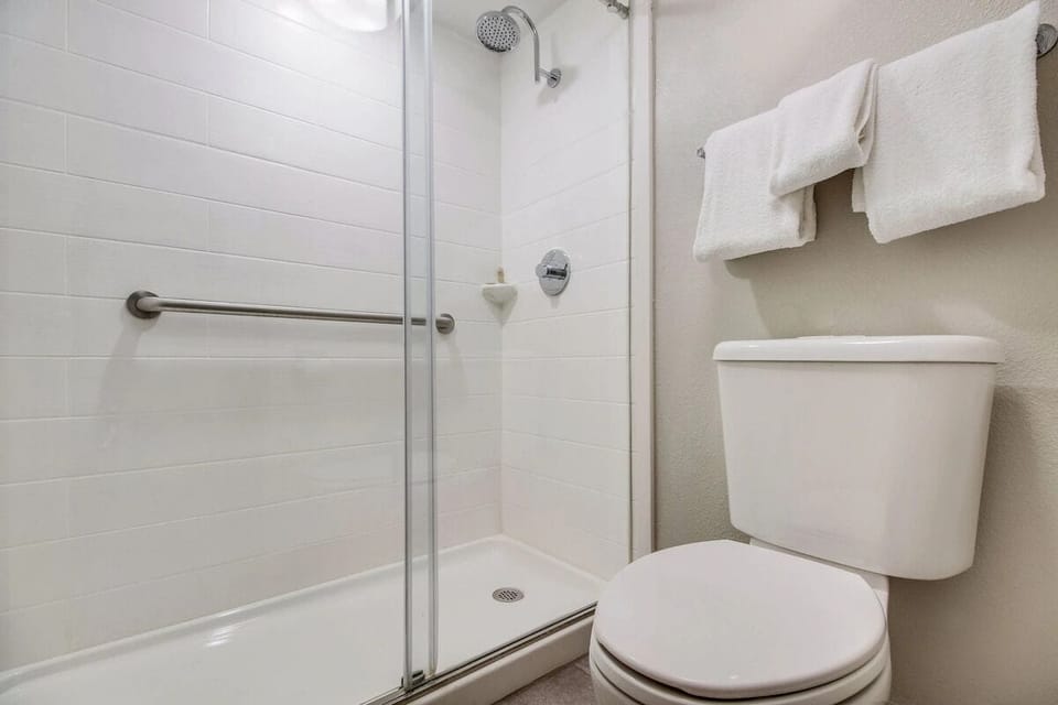 Rinse off under a hot shower in a spotless bath.