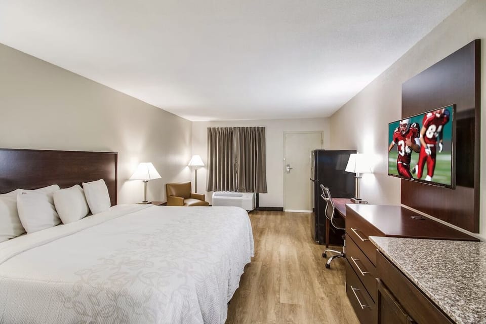 Settle into a spacious king room with TV and desk.