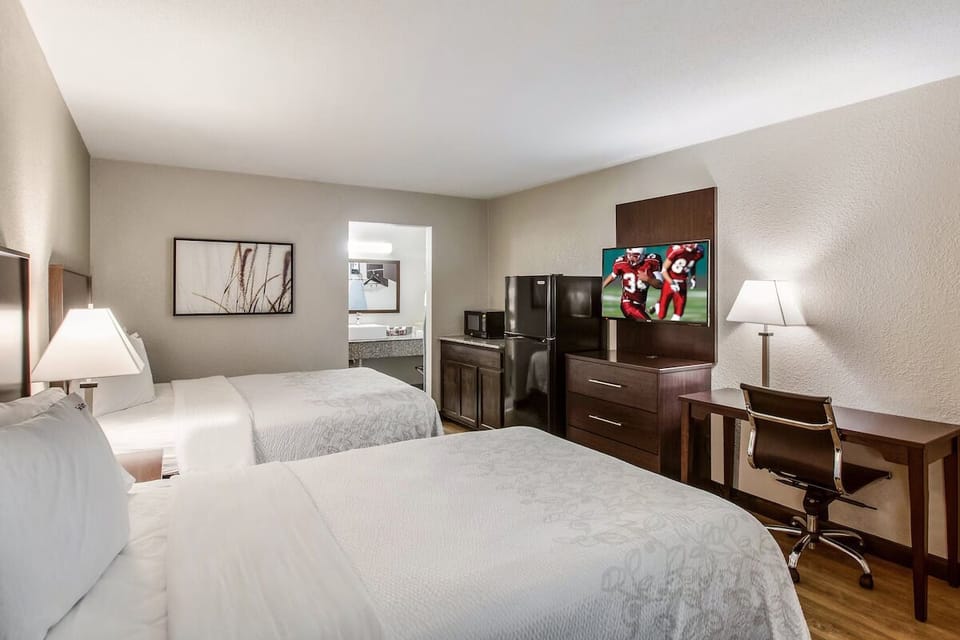 Recharge with mini-fridge convenience and a comfortable desk area.