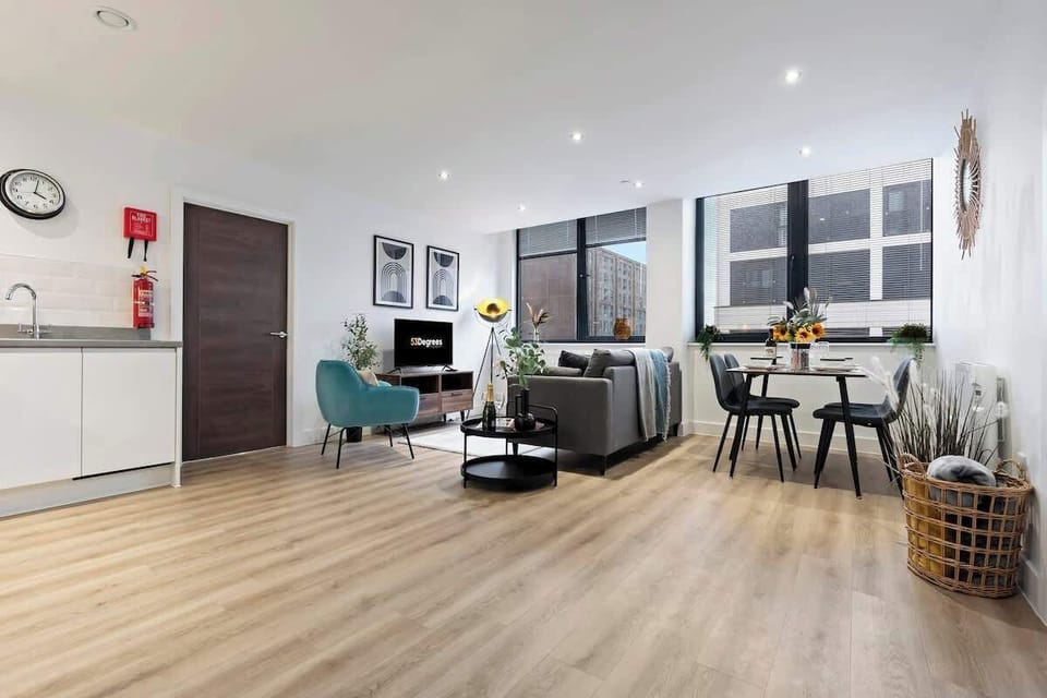 The open-plan living room, dining area and kitchen benefit from a comfortable sofa and 40-inch SMART TV.