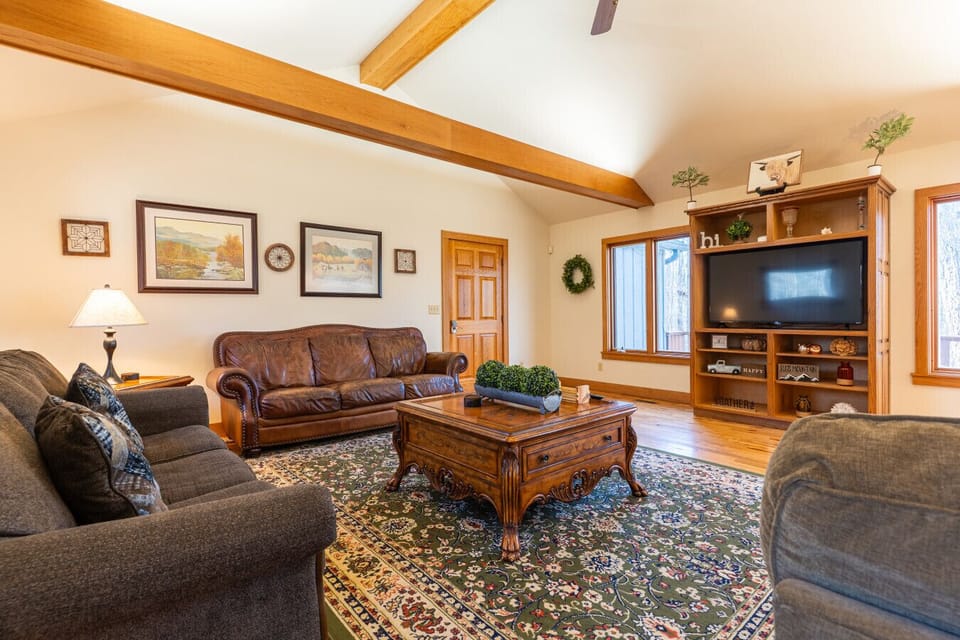 Great room with two couches and one sleeper sofa.