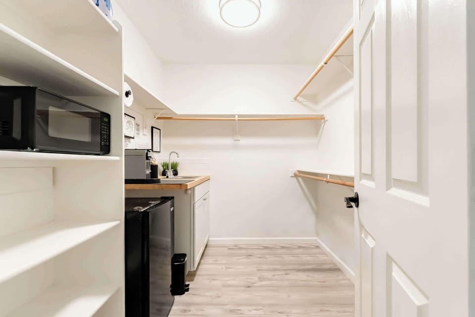 Small kitchen with basic amenities with extra storage space