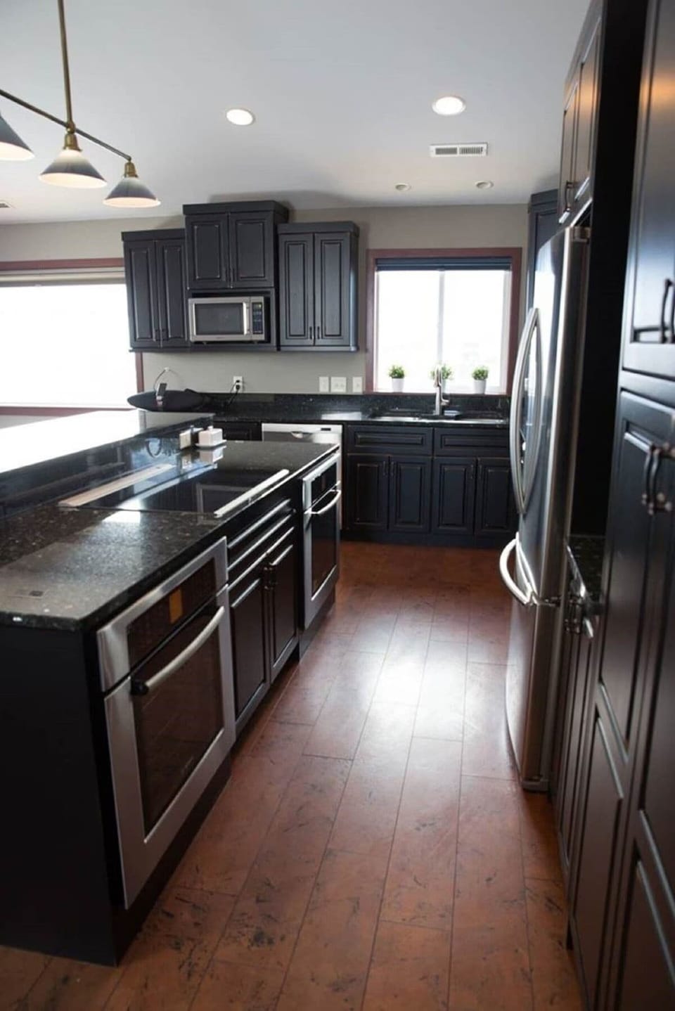 Double ovens, dishwasher and large refrigerator.