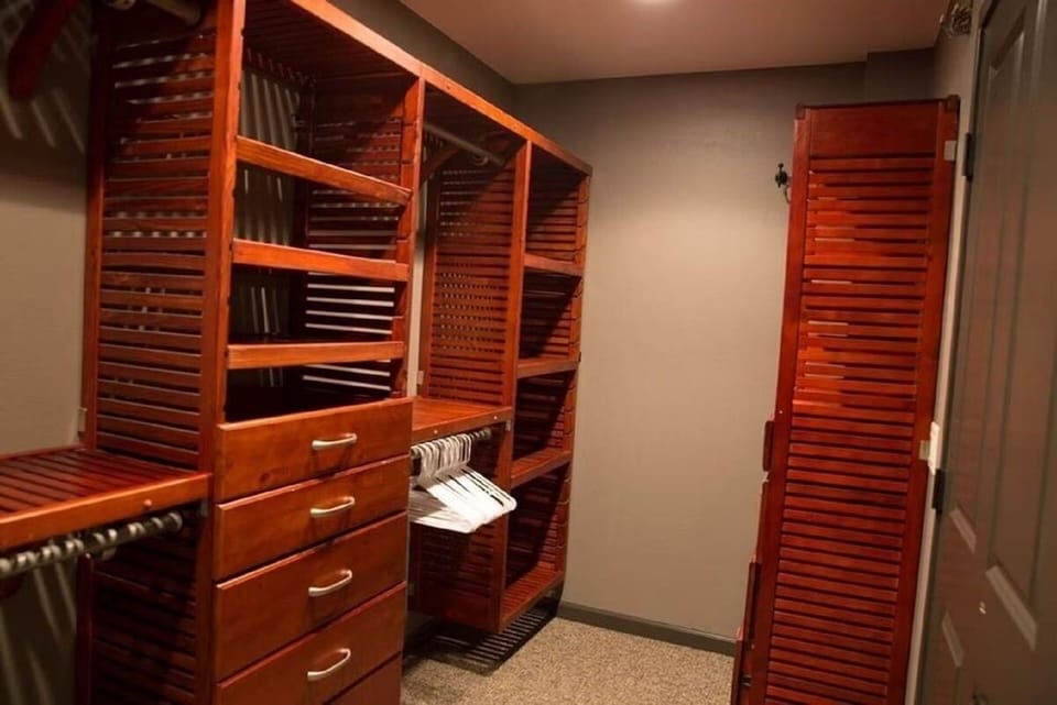 Large walk-in master closet. Includes iron and ironing board.