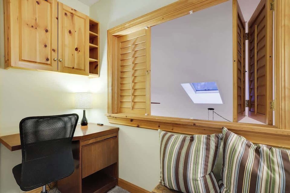 Our cozy bedroom features a dedicated workspace so you can stay productive, even on vacation.