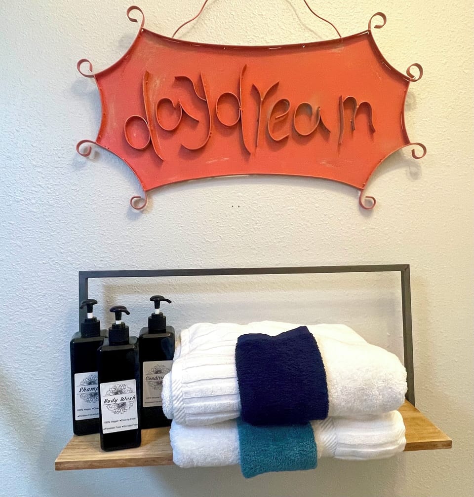 High end bath products and linens stocked throughout the home.