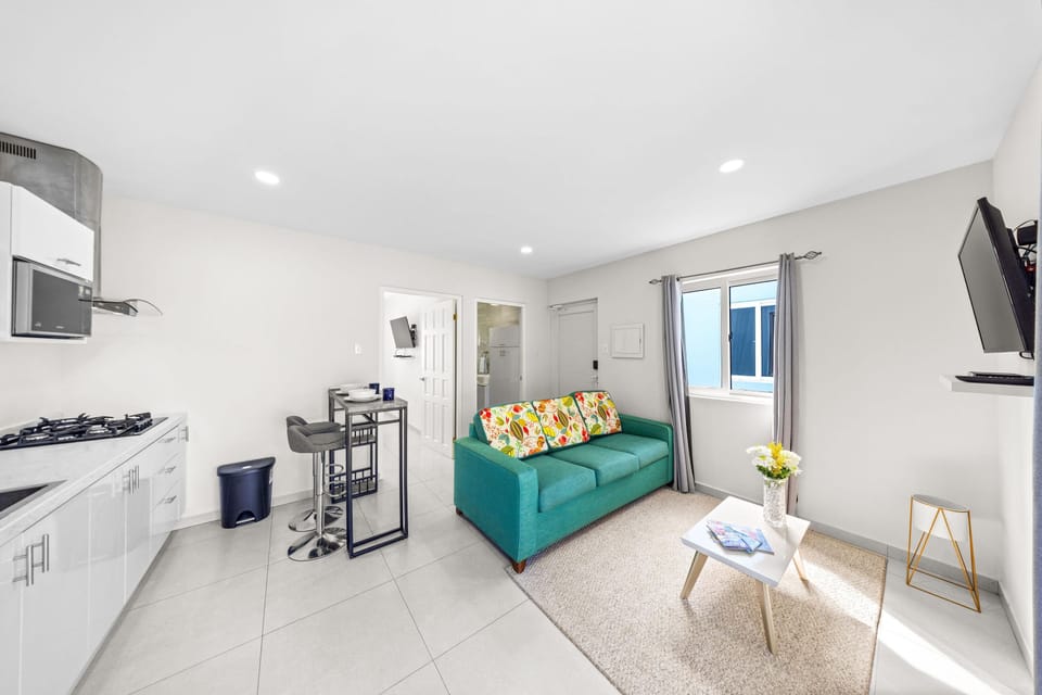 Open-concept living space featuring a well-designed kitchen and a cozy seating area.