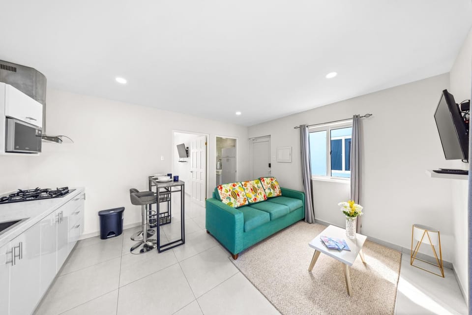 Open-concept living space featuring a well-designed kitchen and a cozy seating area.