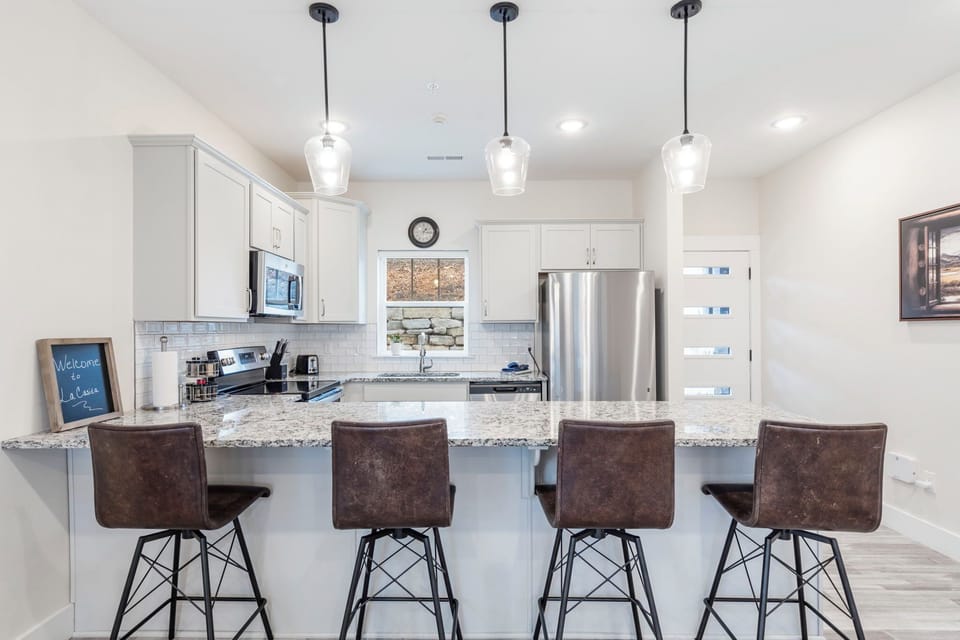 Fully Equipped Kitchen with Additional Bar Seating