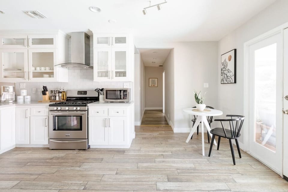 Cute second table in the kitchen that views the gorgeous backyard!
