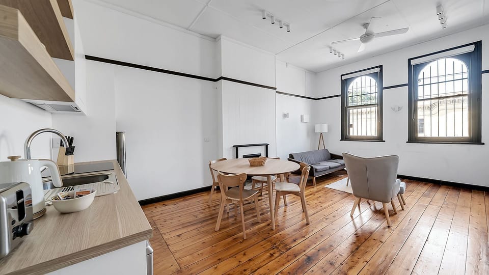 Bright and airy combined kitchen and living area with a clean aesthetic.