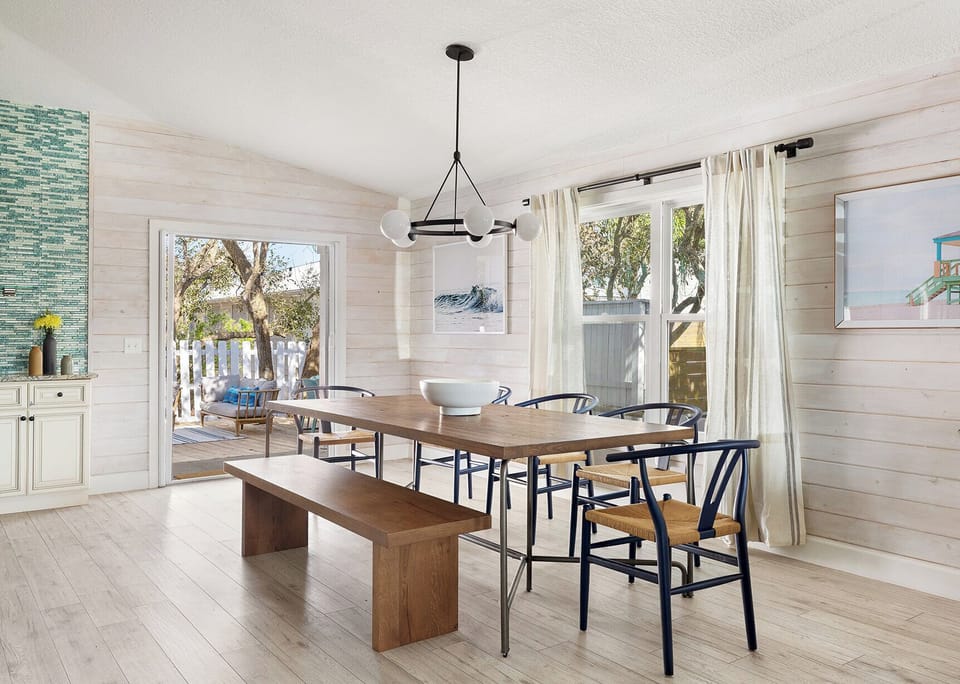 The dining area seats 8 with direct access to the patio.