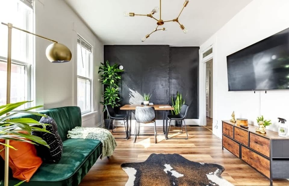 open layout, cozy textures & plant life bring this space to life 