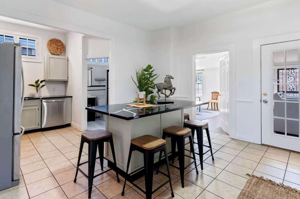 Kitchen: Bright and spacious kitchen featuring top-of-the-line appliances, plenty of counter space, and all the tools for preparing your favorite meals.