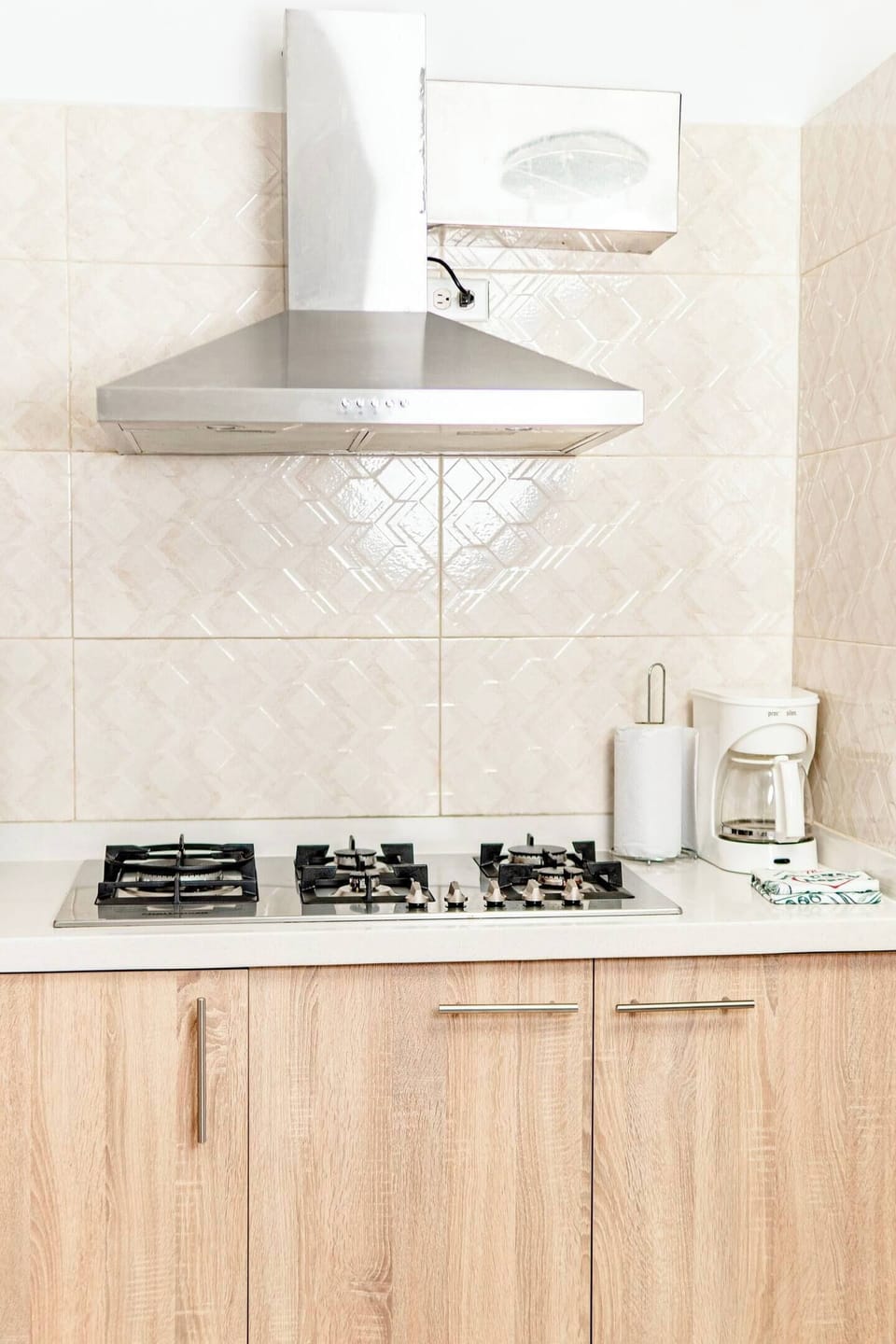Prepare your favorite dishes in this modern kitchen, complete with a gas stove, coffee maker, and ample counter space.