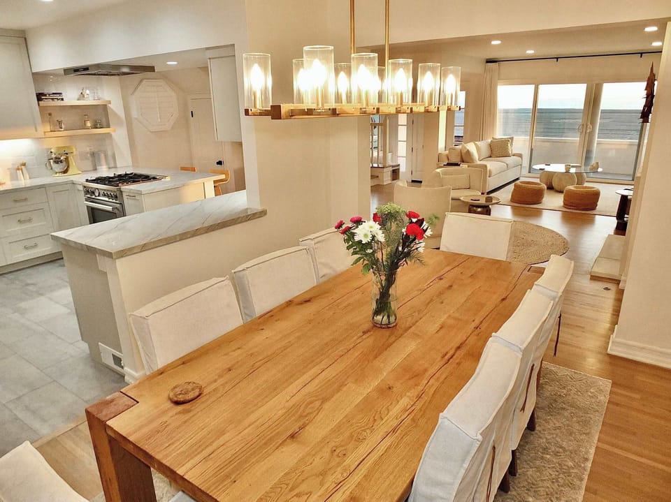 Gather for meals together at the chic dining table, seating 8