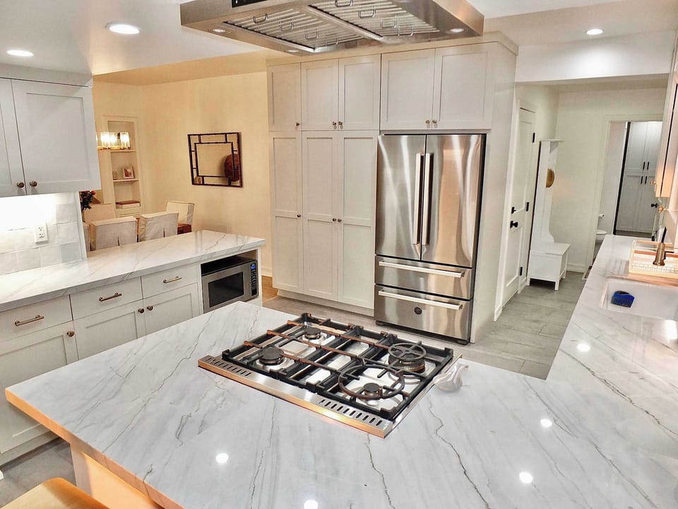 The elegant, open kitchen offers ample space & every home comfort