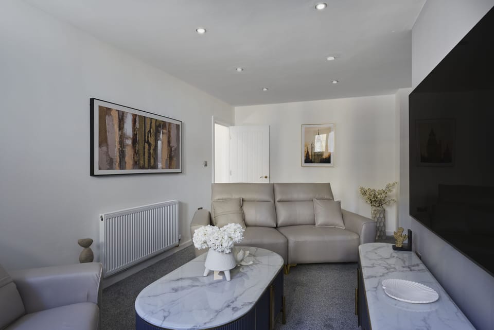 Relax in this comfortable living room, perfect for unwinding after a busy day.