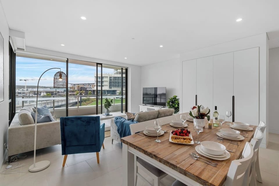 Spacious dining and living areas flow seamlessly onto the balcony, offering stunning marina views.