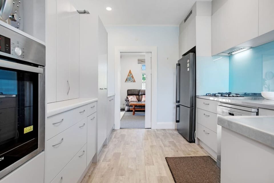 The kitchen is located off the living and dining room areas.