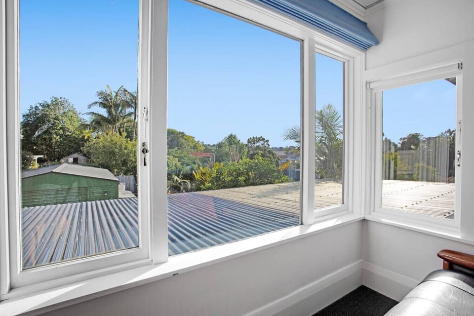 Sit on the couch in the main bedroom and enjoy the sunlight streaming through the windows.