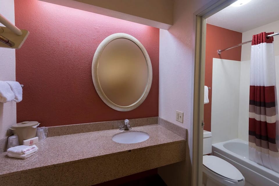 Refresh in a bright, practical bathroom with ample counter space.