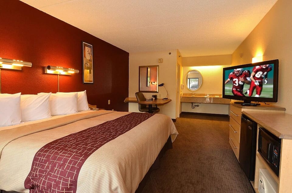 Unwind in a spacious king room with cozy lighting.
