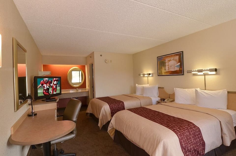 Stretch out with two beds, warm lighting, and plenty of room.