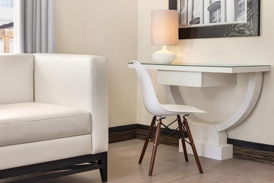Work comfortably with a stylish desk and warm lamp glow.
