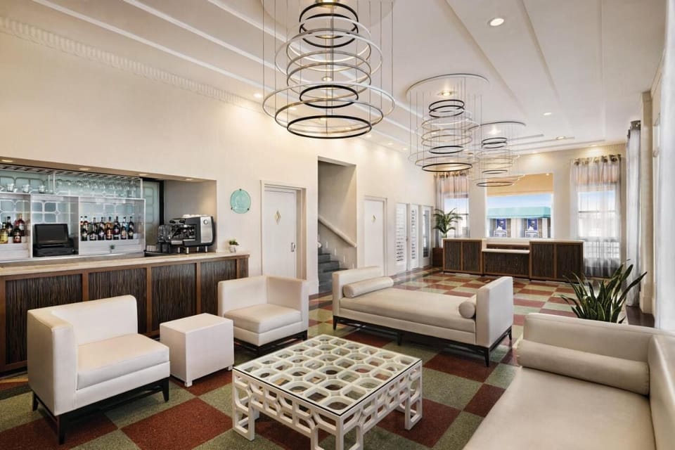 Gather comfortably in the airy lobby framed by elegant lighting.
