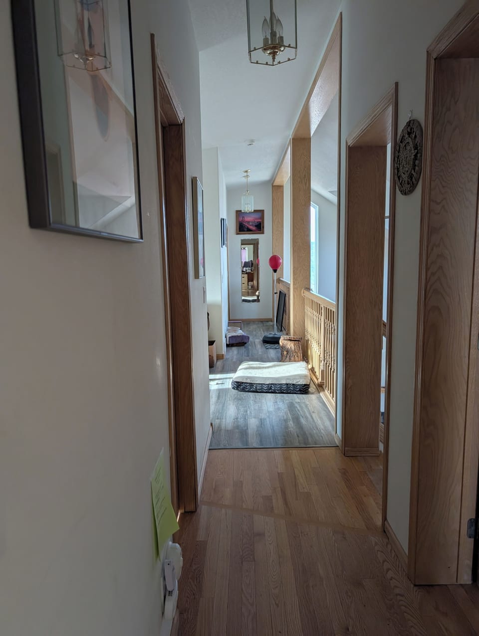 Hall down from room into left side Living with coach sofa queen sleeper