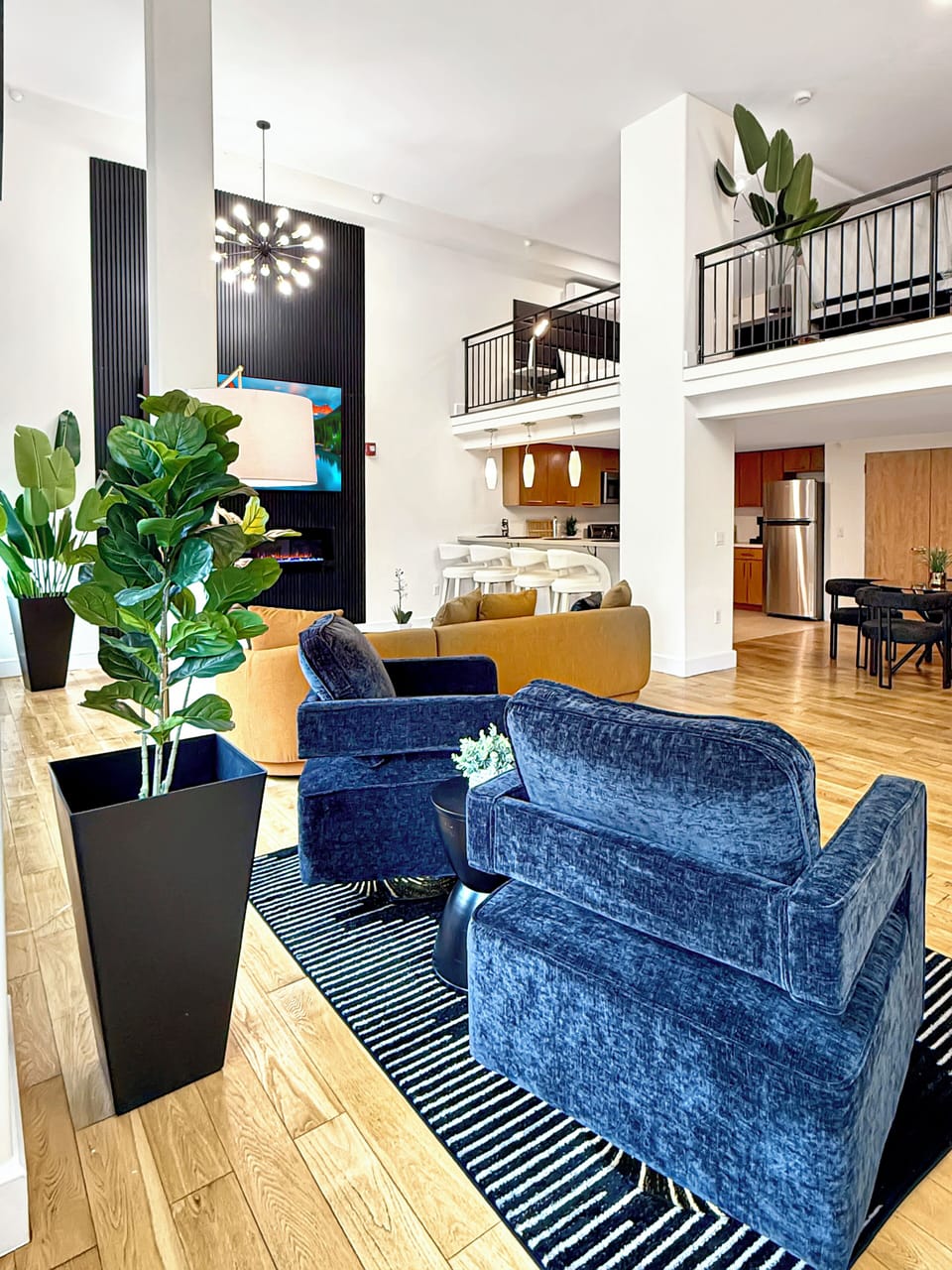 - 85” Smart TV w/ ROKU in main
- Dining Area 
- Breakfast Bar
- Full Kitchen