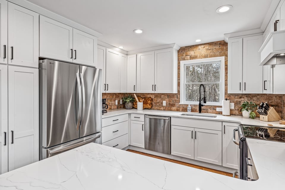 New refrigerator has ice maker in freezer drawer and inside water dispenser.