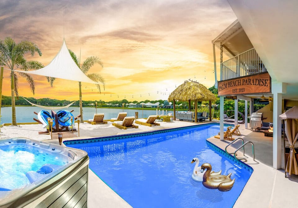 Indulge in the ultimate oasis by retreating to a private haven. Bask in the sun on a secluded beach, unwind in a cozy tiki, and relax in a spacious pool and hot tub while admiring the tranquil scenery of the lakefront.