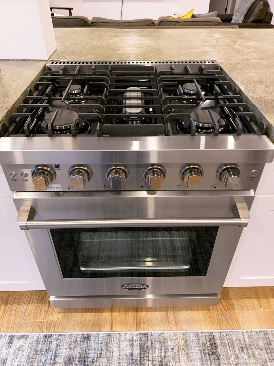 Enjoy cooking on the pro-style, five burner gas range with oven.