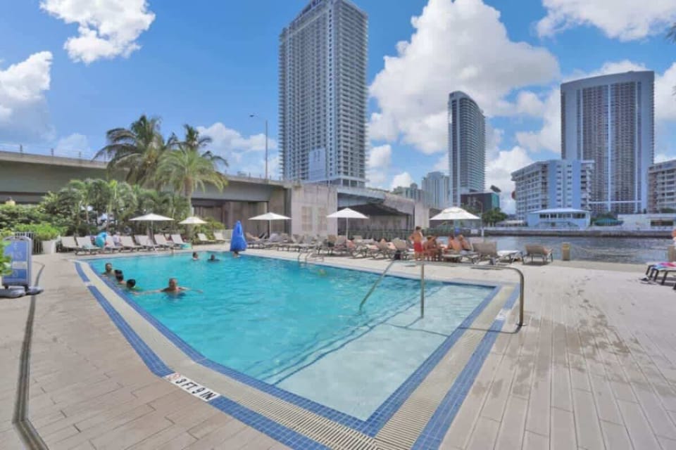 Scenic heated swimming pool with sun loungers and complimentary towels