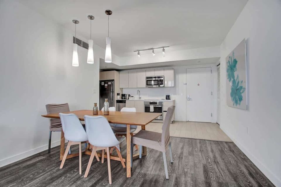 Open space dining area and a fully equipped kitchen with stainless steel appliances to enjoy meals with friends and family