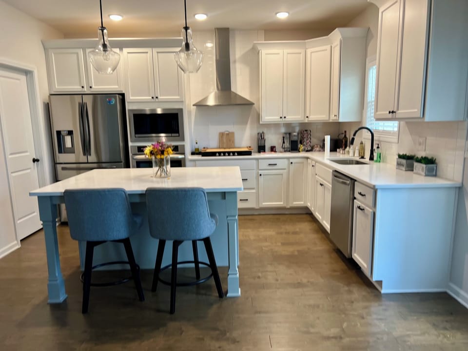 New Kitchen with 5 top gas stove. Wall mounted oven and microwave, dishwasher 