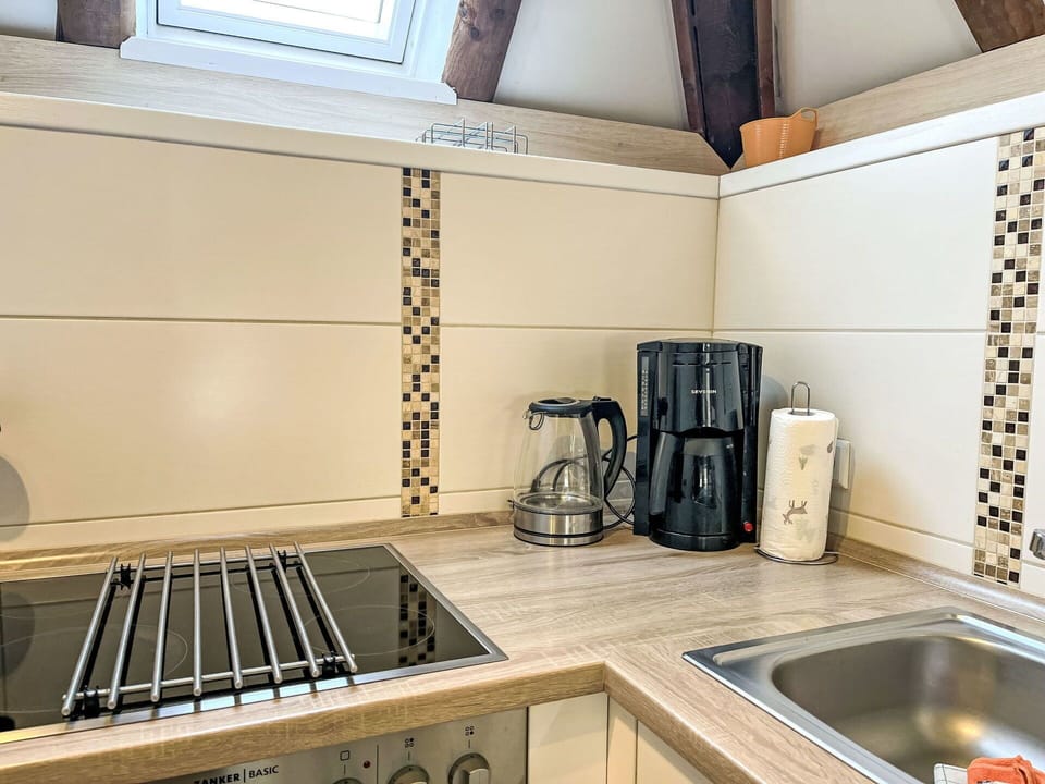 Kitchen, Countertop, Flooring, Kitchen Appliance, Wood, Interior Design, Floor, Tile, Cabinetry, Major Appliance