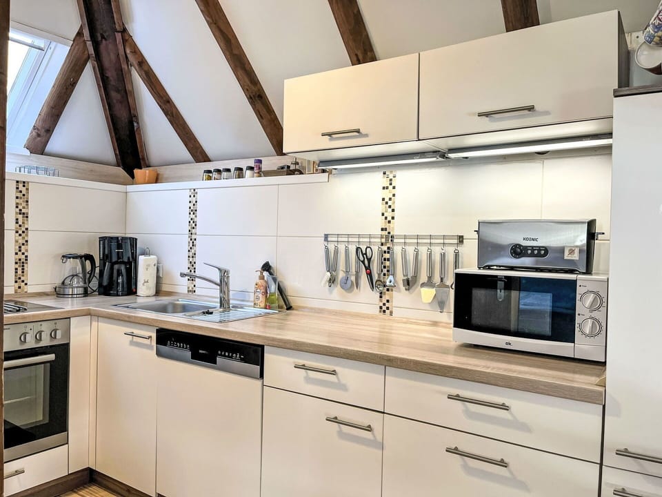 Kitchen, Kitchen Appliance, Countertop, Cabinetry, Major Appliance, Interior Design, Furniture, Flooring, Wood, Home Appliance