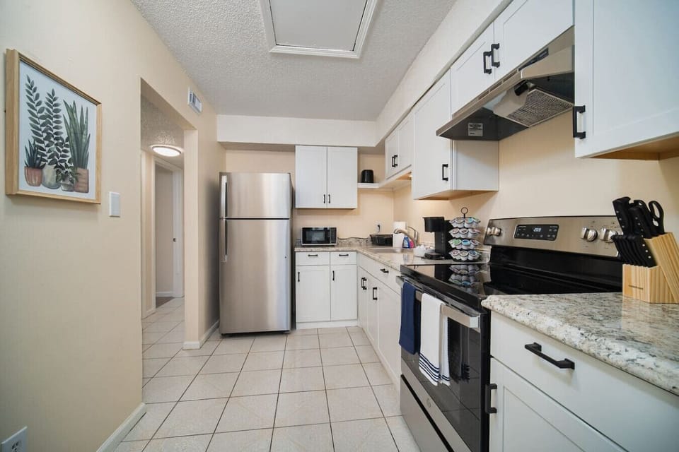 Savor home-cooked meals in your inviting, sunlit kitchen space.