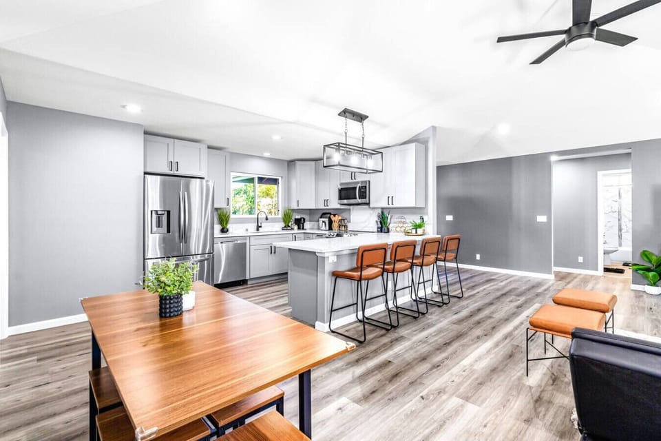 Spacious kitchen featuring sleek cabinets and a central island.