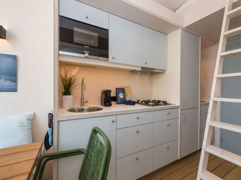 Furniture, Interior Design, Flooring, Floor, Apartment, Cabinetry, Kitchen, Countertop, Room, Wood Stain