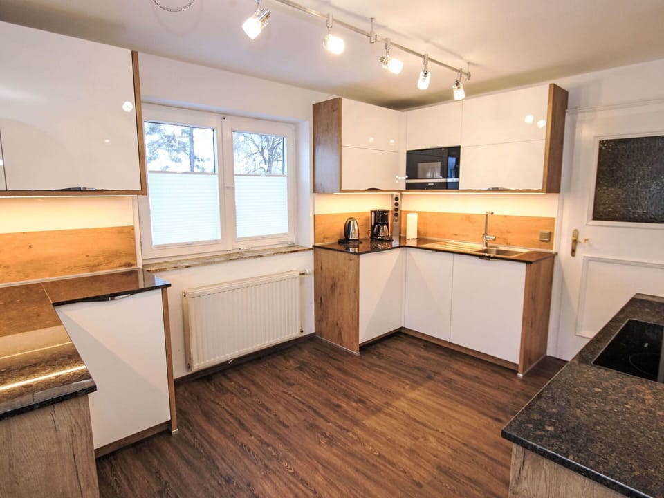 Wood, Flooring, Interior Design, Countertop, Cabinetry, Floor, Kitchen, Wood Flooring, Furniture, Apartment