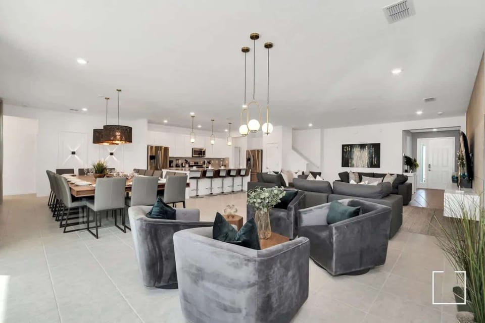 Experience luxury in this expansive open-plan living space, perfect for entertaining with its modern decor and ample seating.