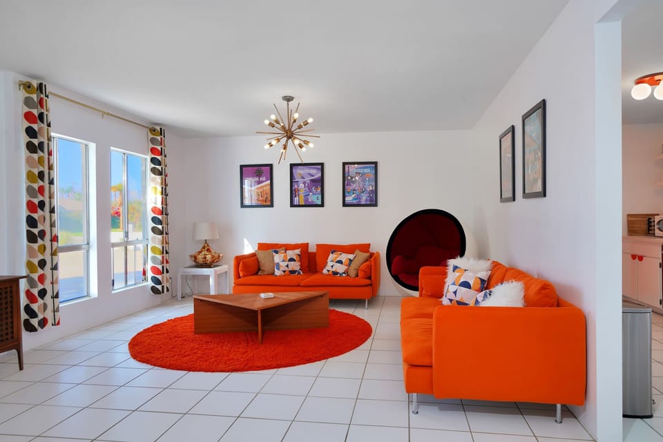 Bright living space with cozy seating and a Smart TV
