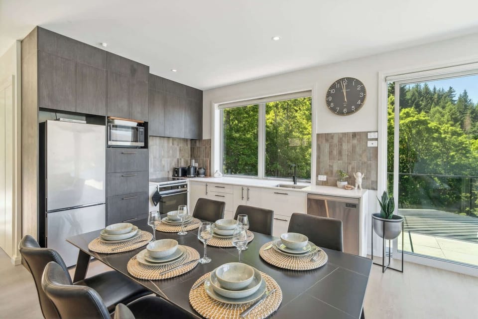Beautiful modern kitchen with incredible views of the mountains and lake.