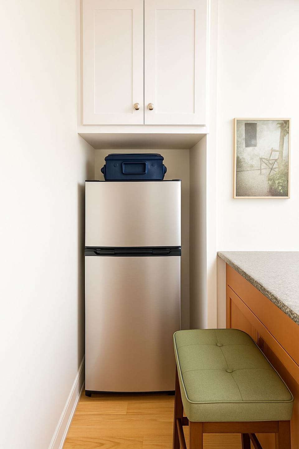 Compact fridge with freezer and comfy breakfast seating”