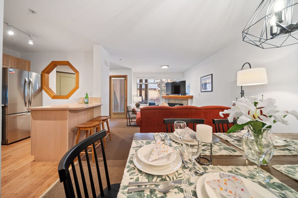 Dining area seamlessly flows into the spacious living area with access to patio.
