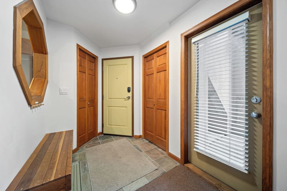 Convenient entrance with mudroom for storing gear and outerwear.